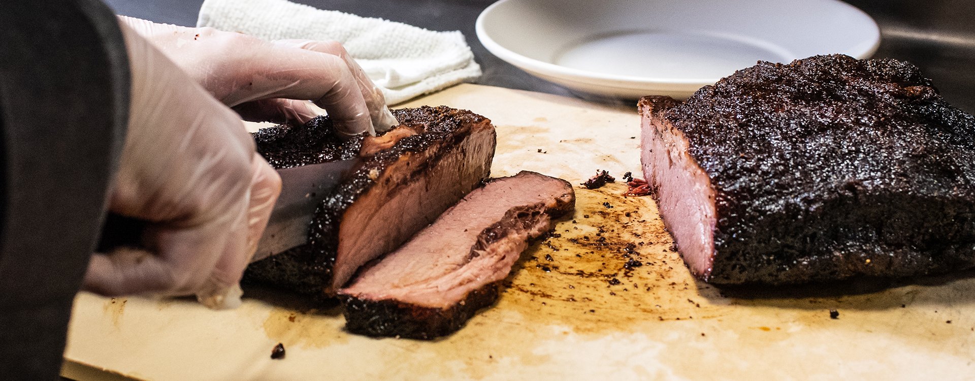Cutting smoked brisket in slices