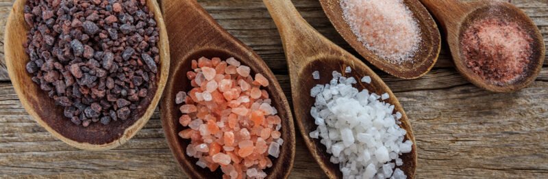 Spoonfuls of different types of salt
