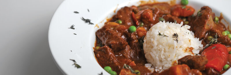 Beef dish topped with white rice