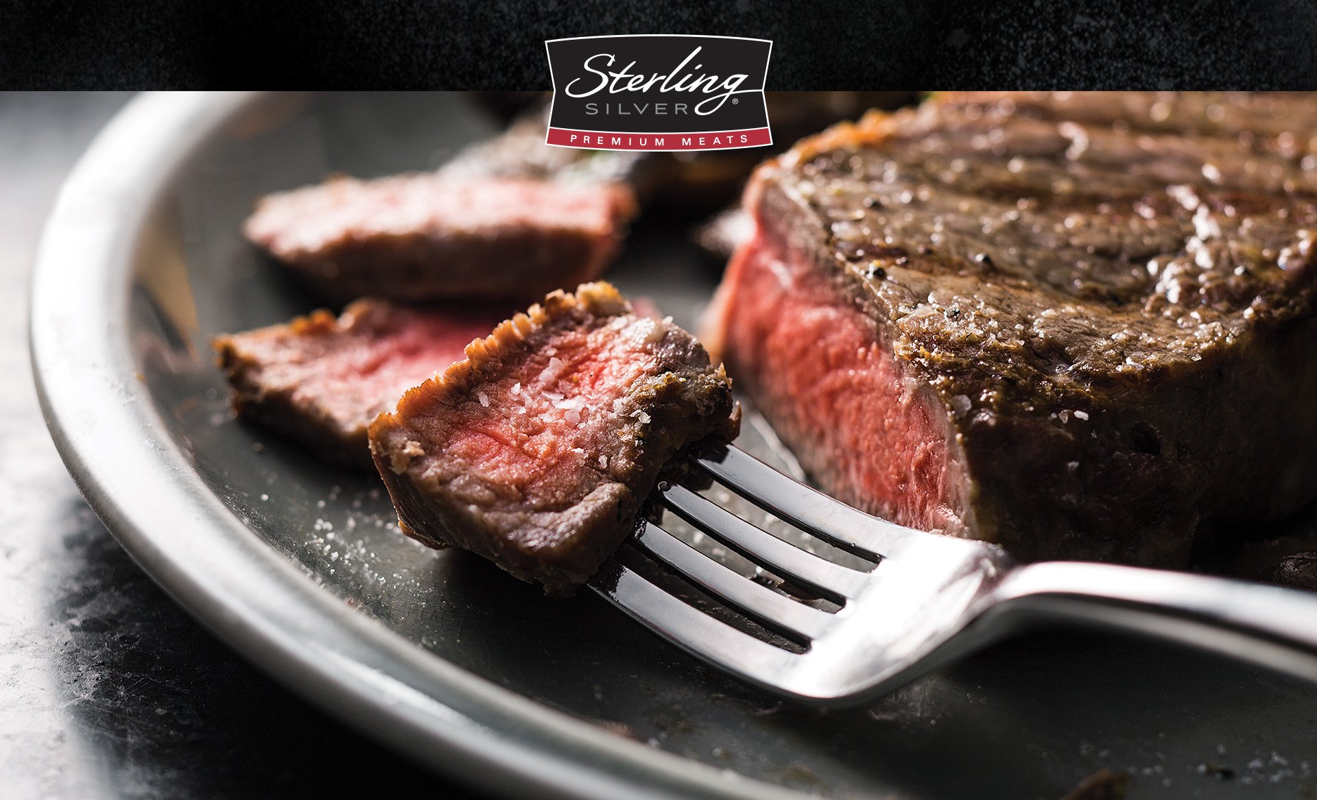 Close up image of cut steak on fork