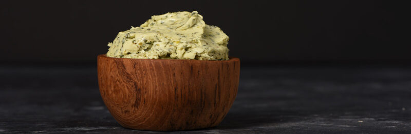 Wooden bowl of compound seasoned butter