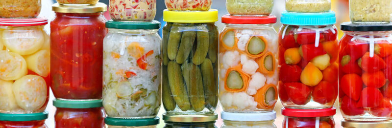 Colorful jars of pickled toppings